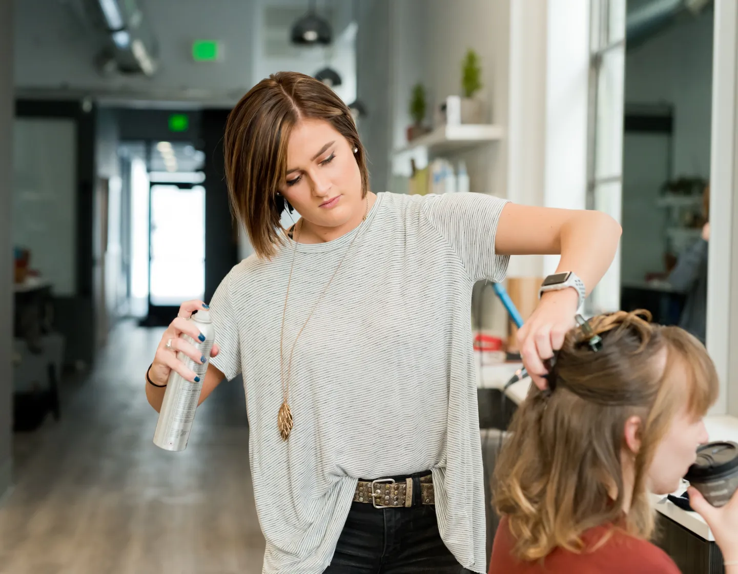 hairdresser with client in salon